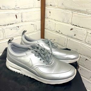 Silver women’s size 8 Nike Thea sneakers. So cute, hardly worn!